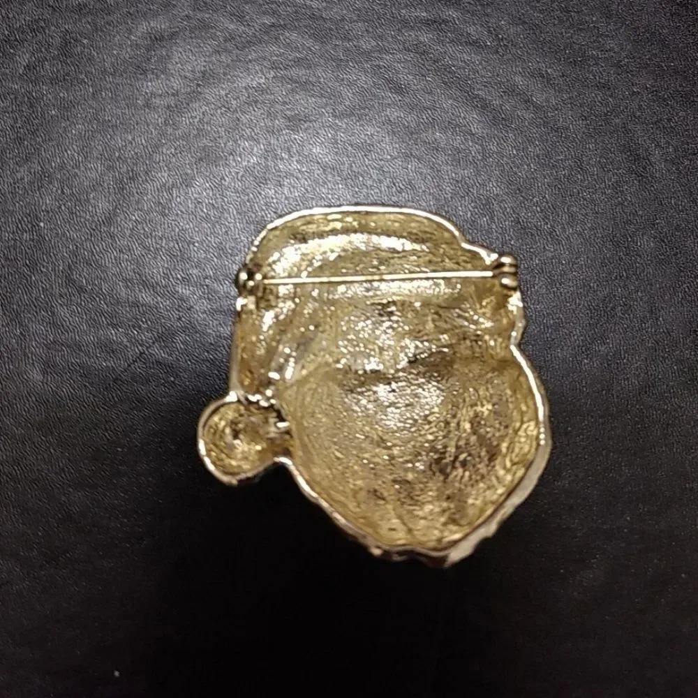 Gold tone vintage Santa Claus brooch